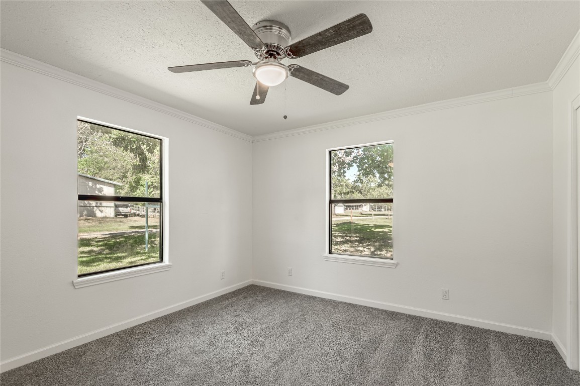 169 Sunset Drive Trinity, TX 75862 - Photo 19 of 36 en empty room with windows