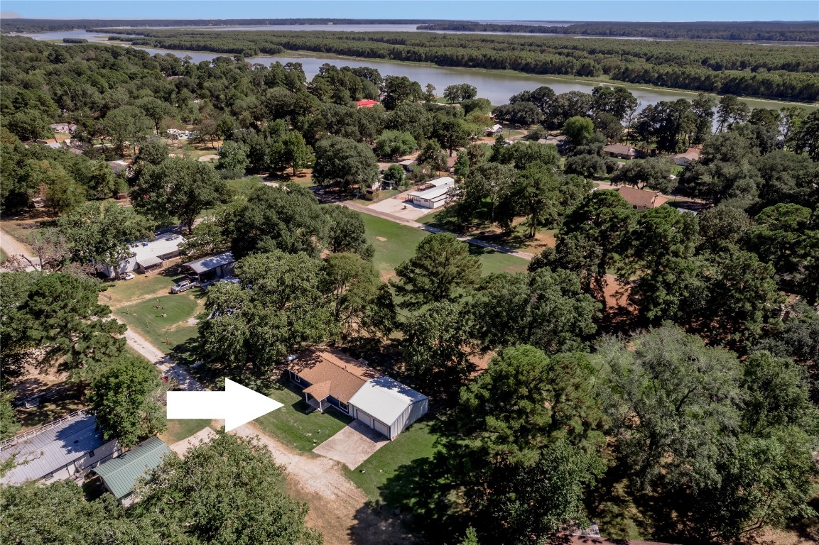 169 Sunset Drive Trinity, TX 75862 - Photo 2 of 36 an aerial view of residential house with outdoor space and trees all around