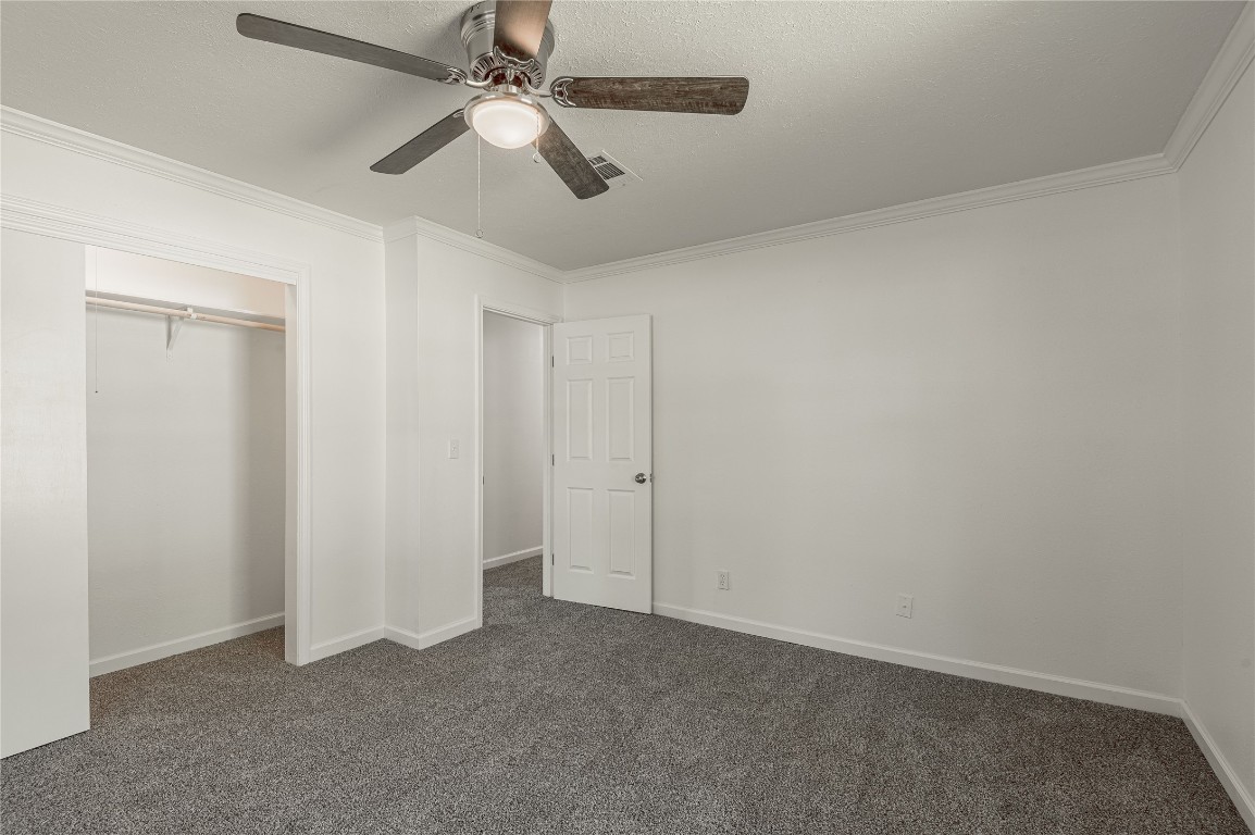 169 Sunset Drive Trinity, TX 75862 - Photo 21 of 36 an empty room with chandelier fan