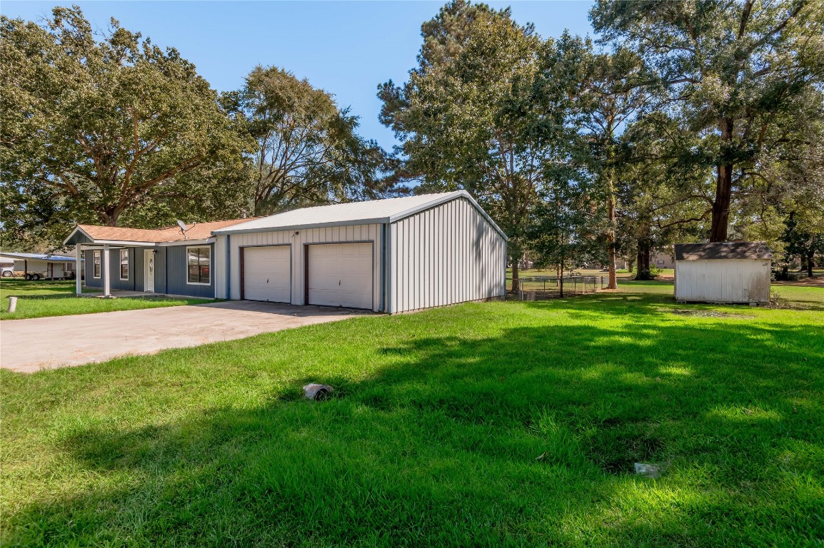 169 Sunset Drive Trinity, TX 75862 - Photo 28 of 36 a house view with a garden space