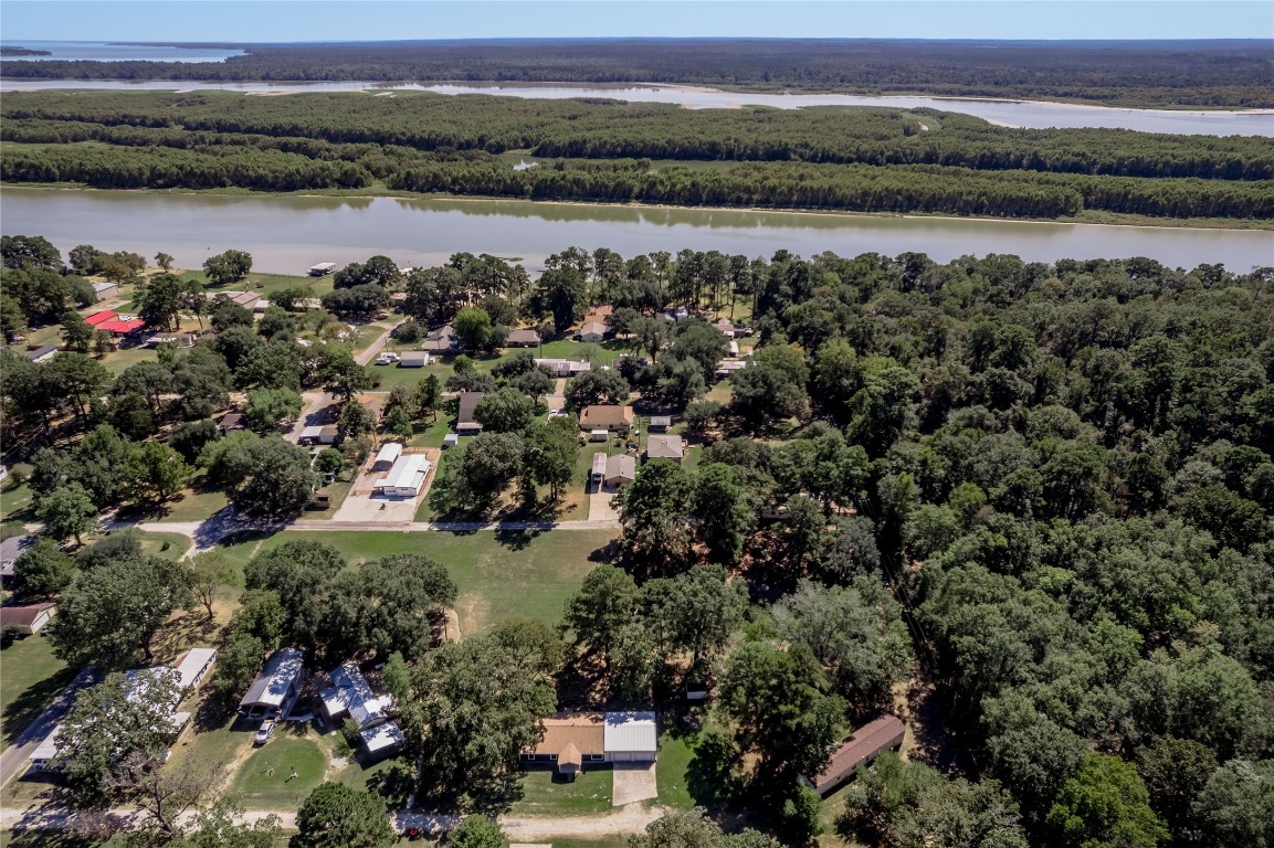 169 Sunset Drive Trinity, TX 75862 - Photo 35 of 36 a view of a lake with houses in the back