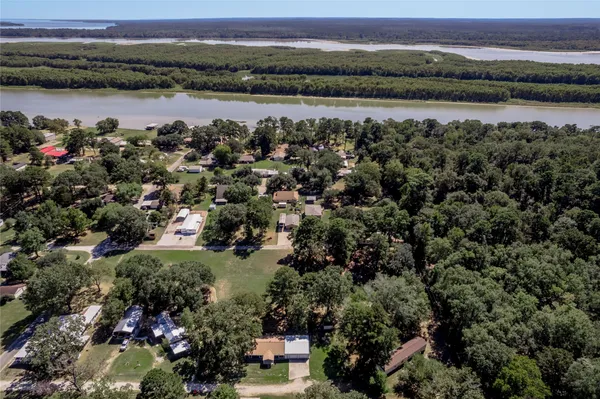 a view of a lake with houses in the back