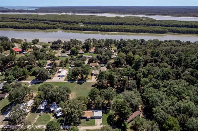 a view of a lake with houses in the back