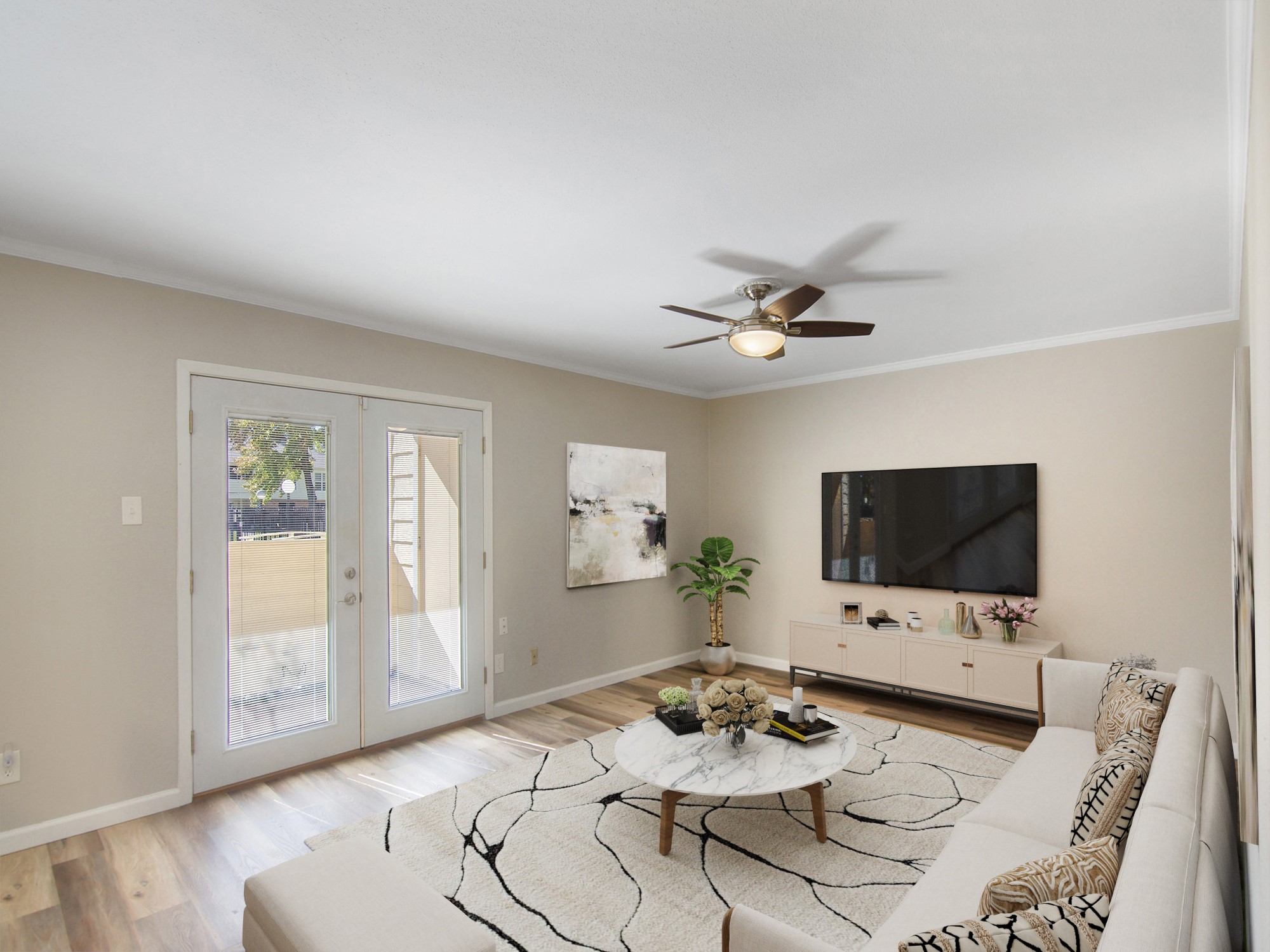Virtually staged spacious living area with french doors