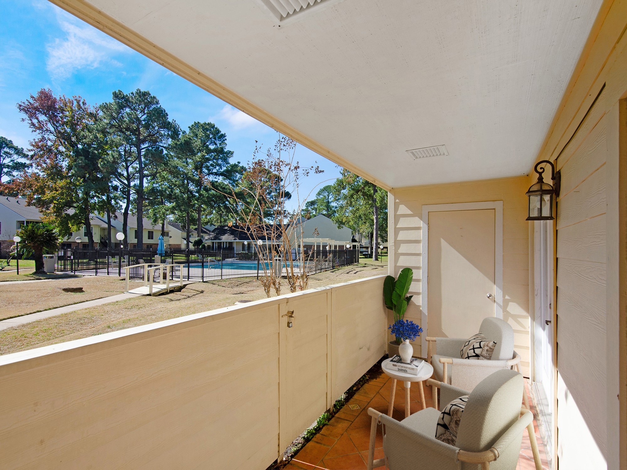 14555 Wunderlich Drive, Unit 2307 Houston, TX 77069 - Photo 25 of 42 Virtually staged covered, gated patio with a view of the pool area