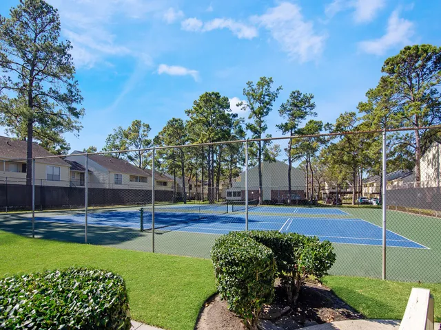 a view of a house with pool and sitting area