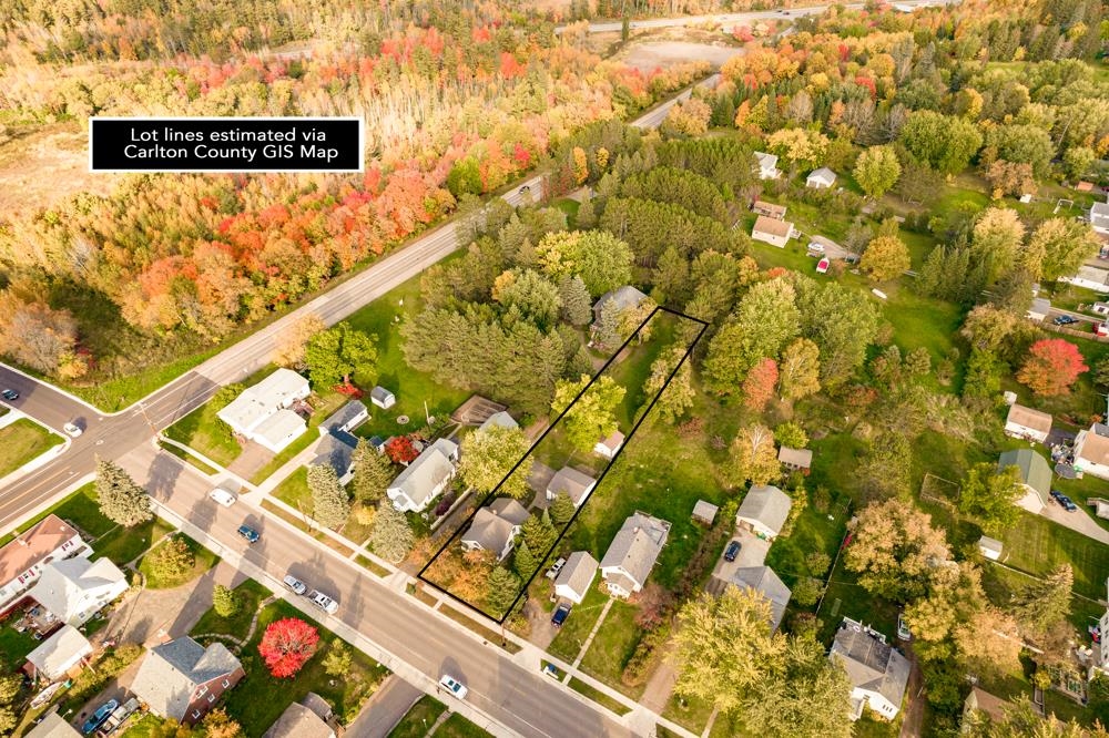 312 22nd Street Cloquet, MN 55720 - Photo 7 of 45 Aerial view of property and surrounding area with property boundaries highlighted and nearby suburban area