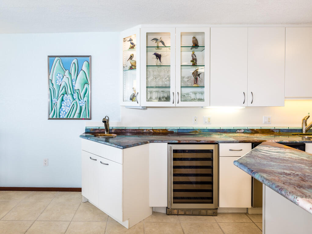 101 East Ocean Drive, Unit C304 Key Colony Beach, FL 33051 - Photo 12 of 39 a kitchen with stainless steel appliances granite countertop a stove and a sink