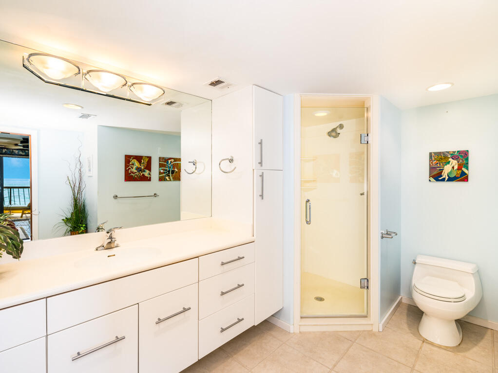 101 East Ocean Drive, Unit C304 Key Colony Beach, FL 33051 - Photo 16 of 39 a bathroom with a toilet sink and shower