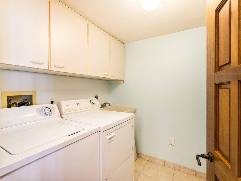 101 East Ocean Drive, Unit C304 Key Colony Beach, FL 33051 - Photo 21 of 39 a utility room with dryer and washer