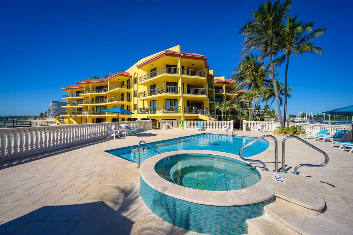 101 East Ocean Drive, Unit C304 Key Colony Beach, FL 33051 - Photo 27 of 39 a roof deck with a table and chairs