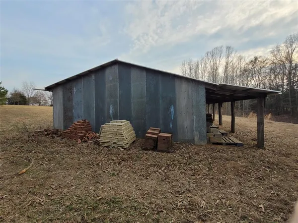 a house with trees in the background