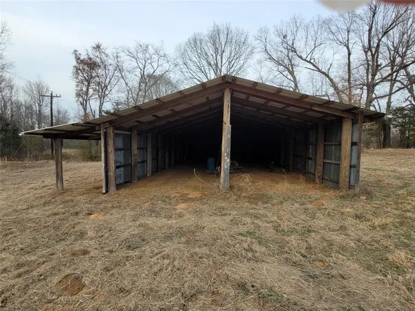 a view of an empty room with a staircase