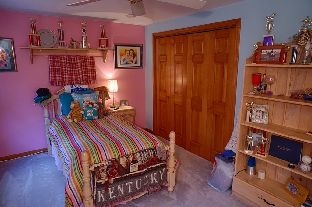 93 Crawford Road Rutland, MA 01543 - Photo 11 of 30 a bedroom with furniture and a book shelf