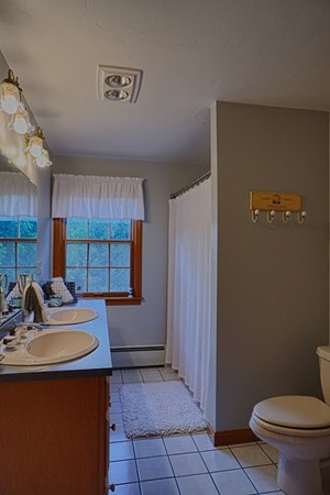 93 Crawford Road Rutland, MA 01543 - Photo 12 of 30 a kitchen with a sink a toilet and cabinets