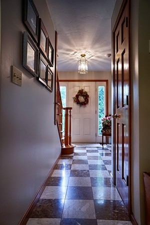 93 Crawford Road Rutland, MA 01543 - Photo 8 of 30 a view of a hallway with wooden floor and staircase
