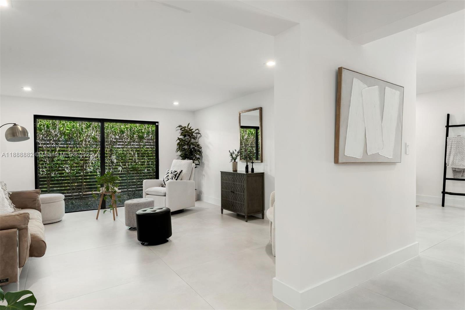 420 Southwest 19th Road Miami, FL 33129 - Photo 11 of 32 a living room with furniture and a large window
