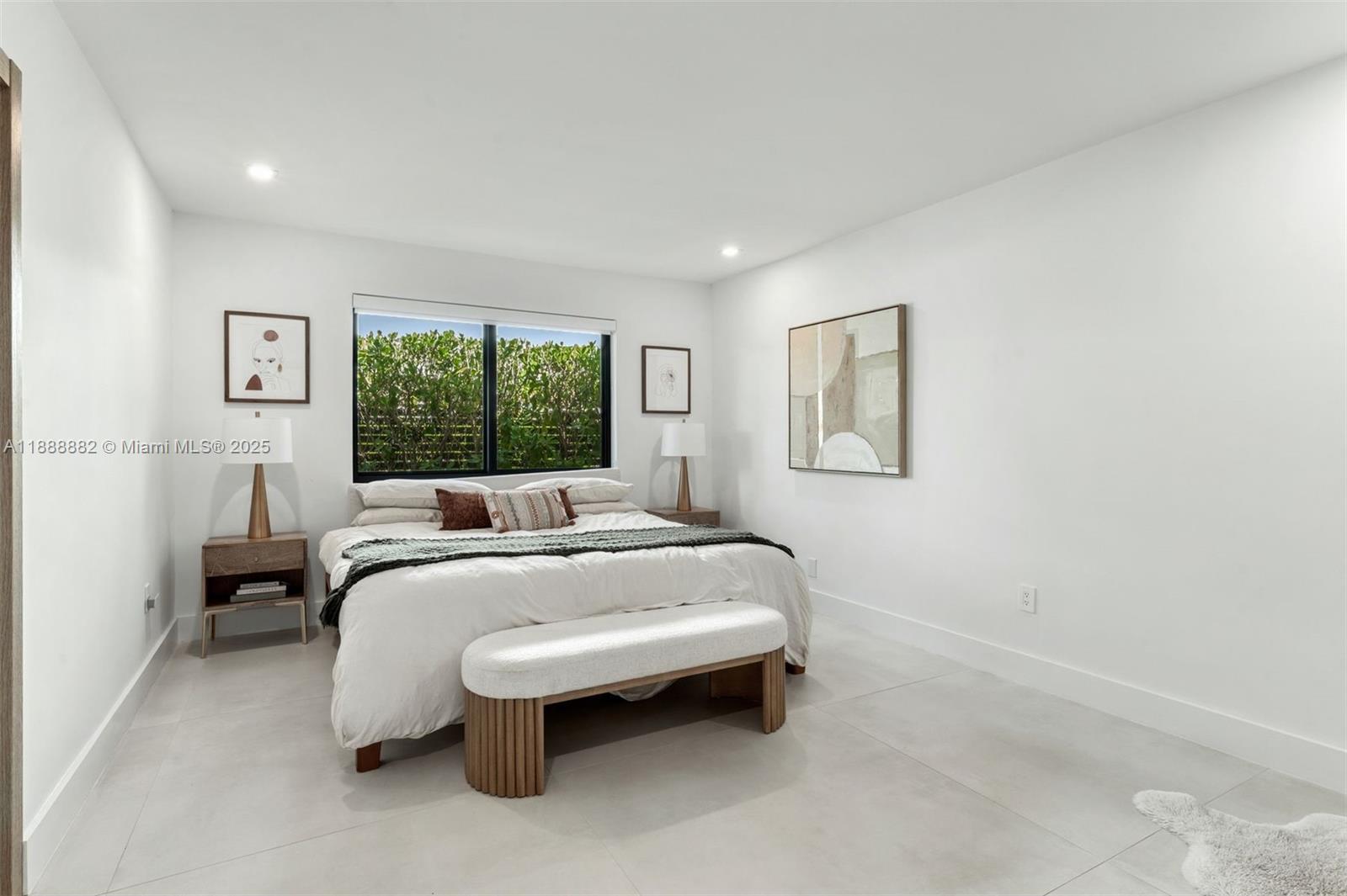 420 Southwest 19th Road Miami, FL 33129 - Photo 13 of 32 a bedroom with a bed and a table