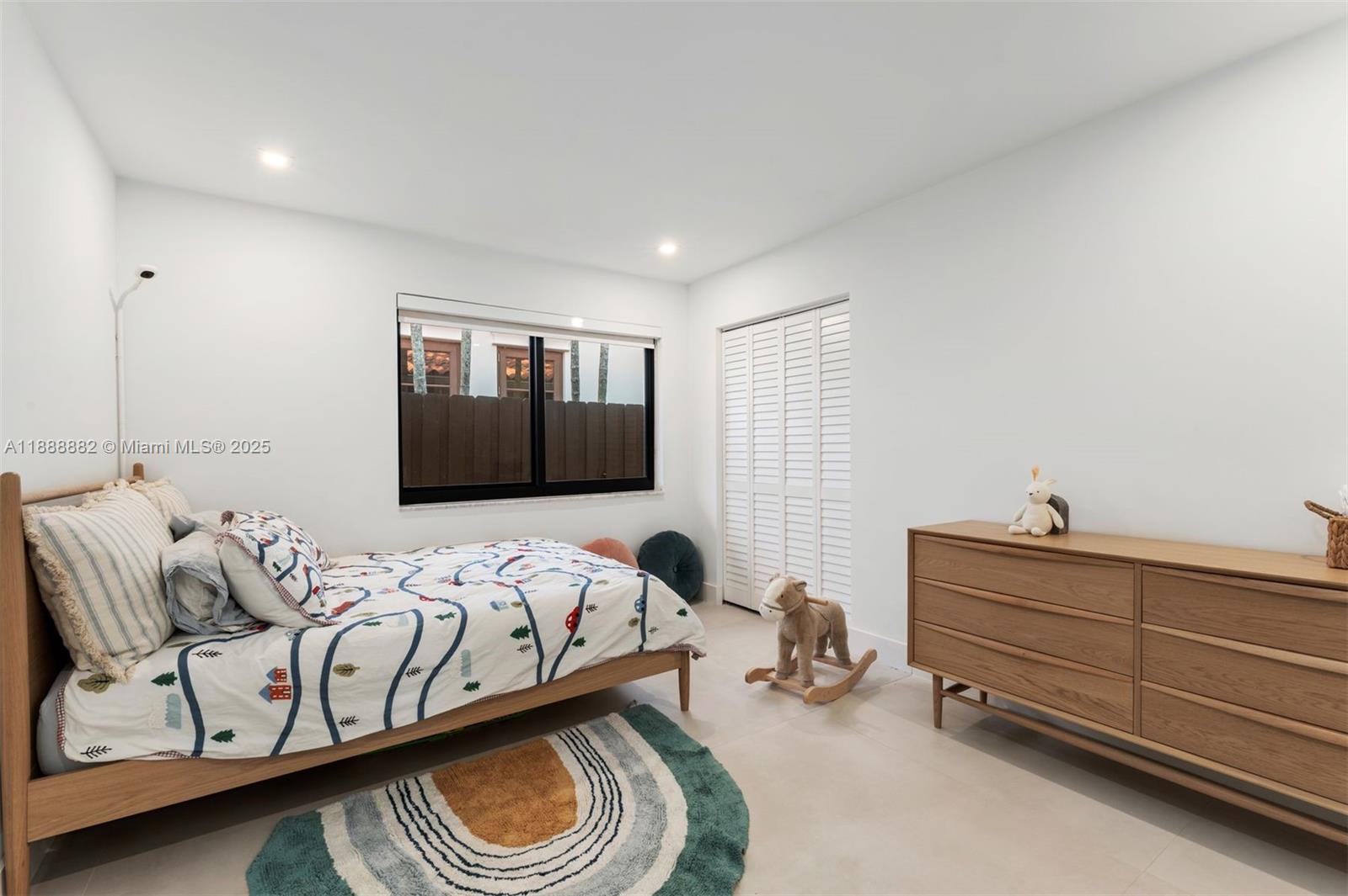 420 Southwest 19th Road Miami, FL 33129 - Photo 16 of 32 a bedroom with bed and a window