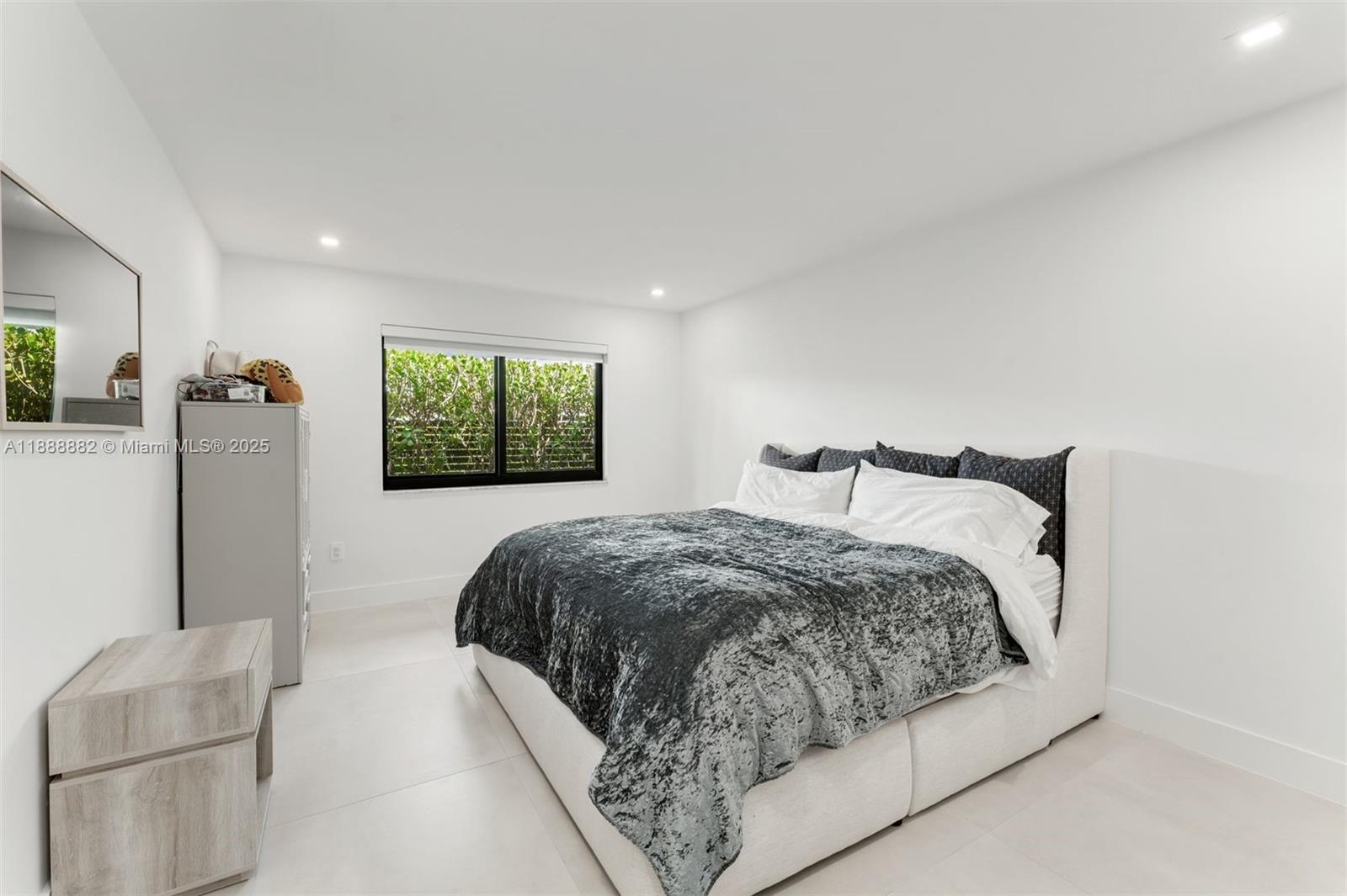 420 Southwest 19th Road Miami, FL 33129 - Photo 17 of 32 a bedroom with a bed and a window