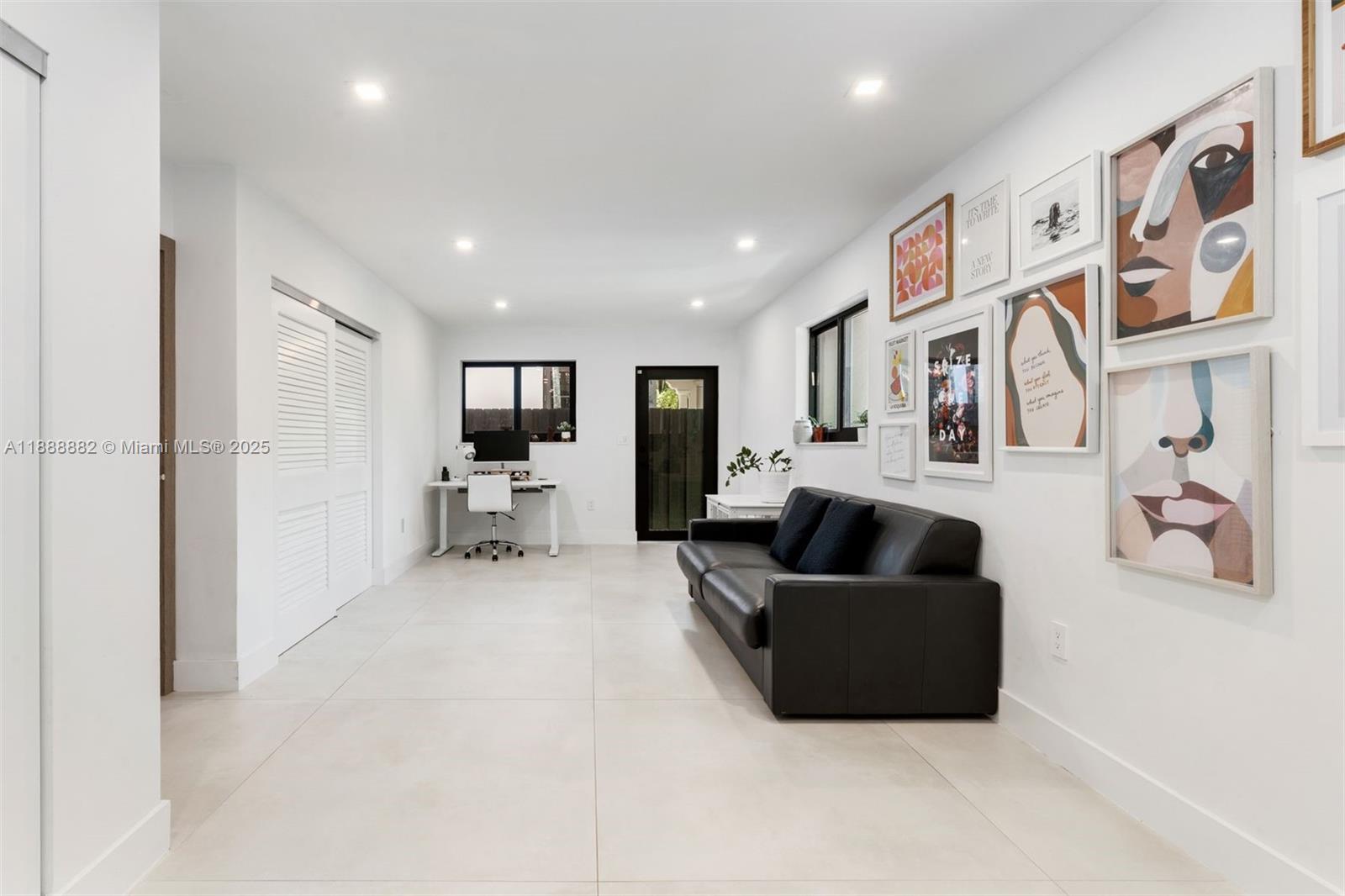 420 Southwest 19th Road Miami, FL 33129 - Photo 20 of 32 a living room with furniture and a flat screen tv