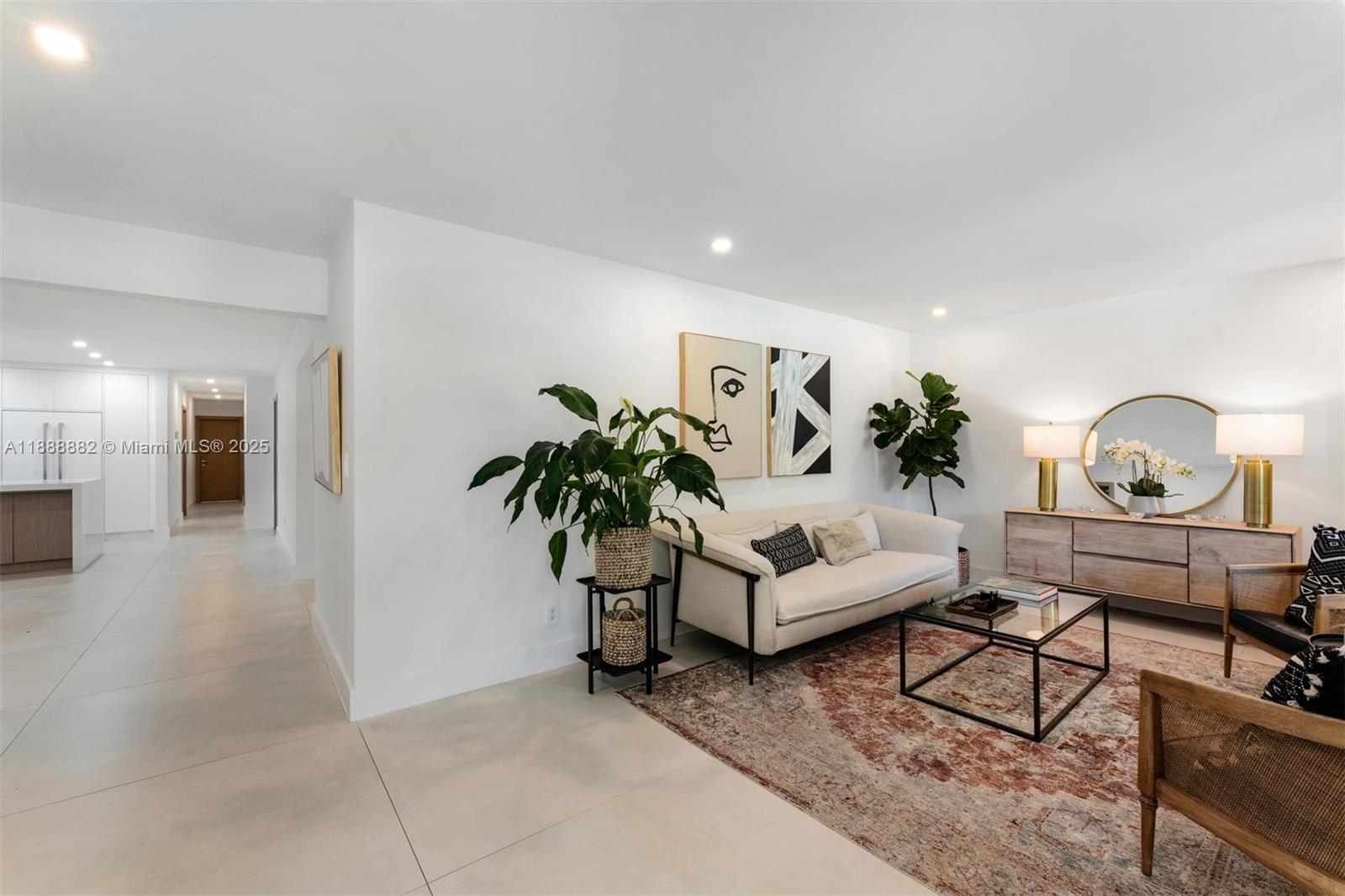 420 Southwest 19th Road Miami, FL 33129 - Photo 2 of 32 a living room with furniture and a potted plant