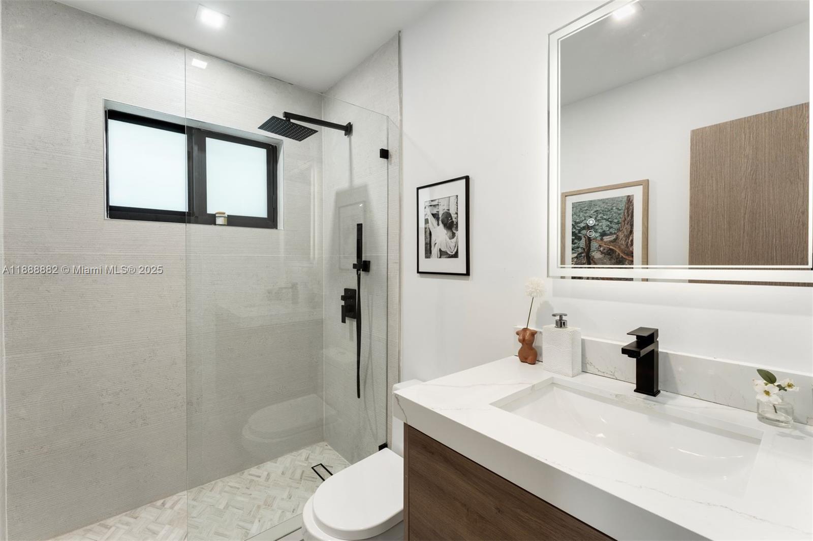 420 Southwest 19th Road Miami, FL 33129 - Photo 21 of 32 a bathroom with a sink toilet and shower