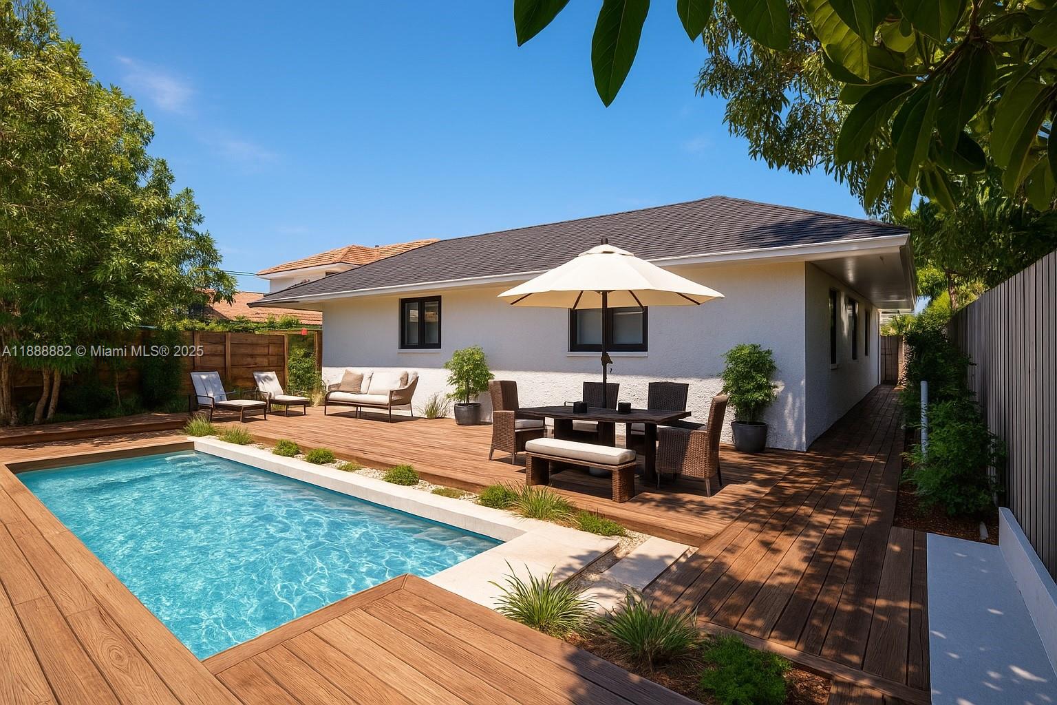 420 Southwest 19th Road Miami, FL 33129 - Photo 22 of 32 a view of a house with backyard swimming pool and sitting area