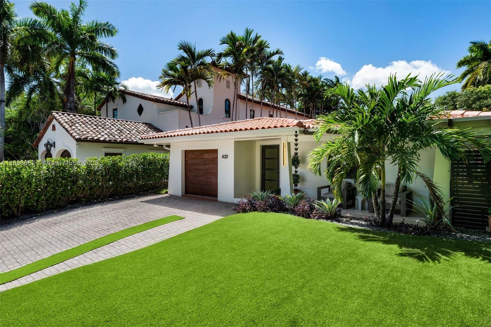 420 Southwest 19th Road Miami, FL 33129 - Photo 30 of 32 a view of a house with a yard and potted plants