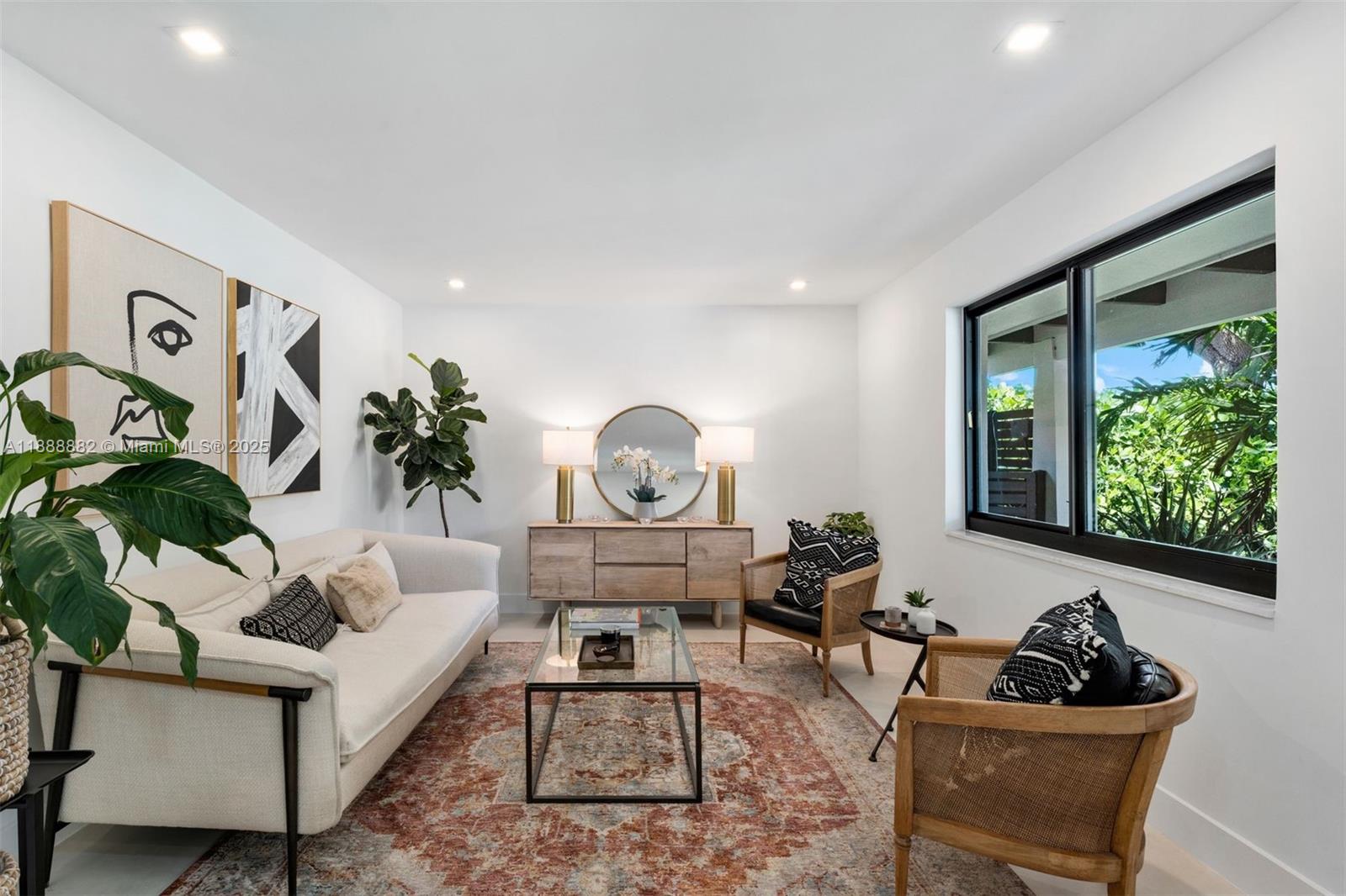 420 Southwest 19th Road Miami, FL 33129 - Photo 3 of 32 a living room with furniture and a potted plant