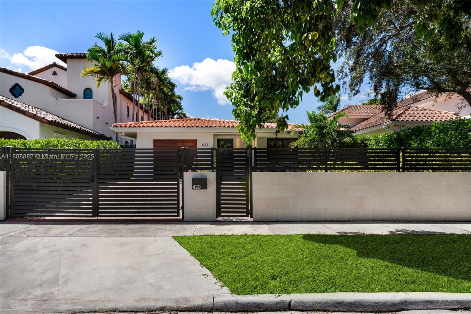 420 Southwest 19th Road Miami, FL 33129 - Photo 32 of 32 a front view of a house with a garden
