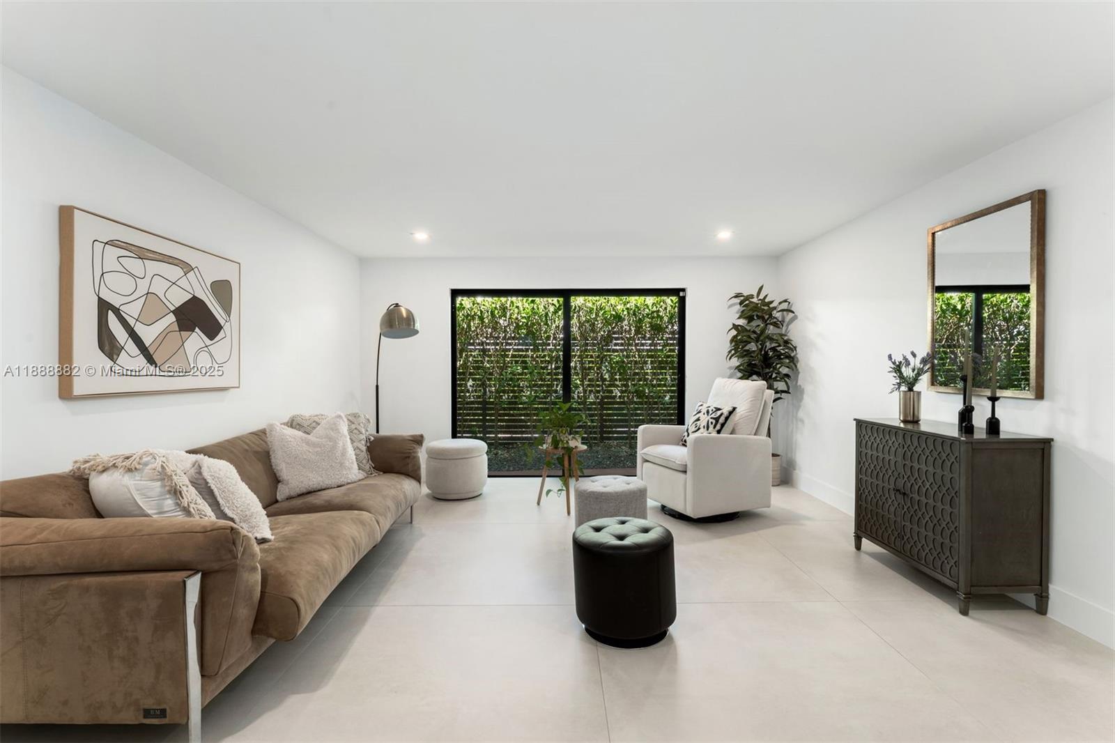 420 Southwest 19th Road Miami, FL 33129 - Photo 10 of 32 a living room with furniture large window and flat screen tv
