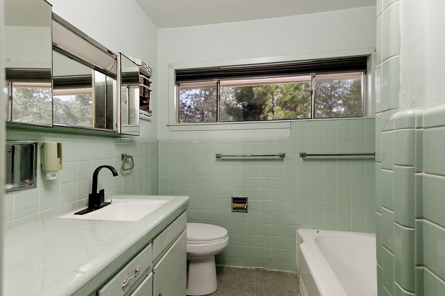 7185 Highway 75 Huntsville, TX 77340 - Photo 23 of 33 a bathroom with a toilet sink and mirror