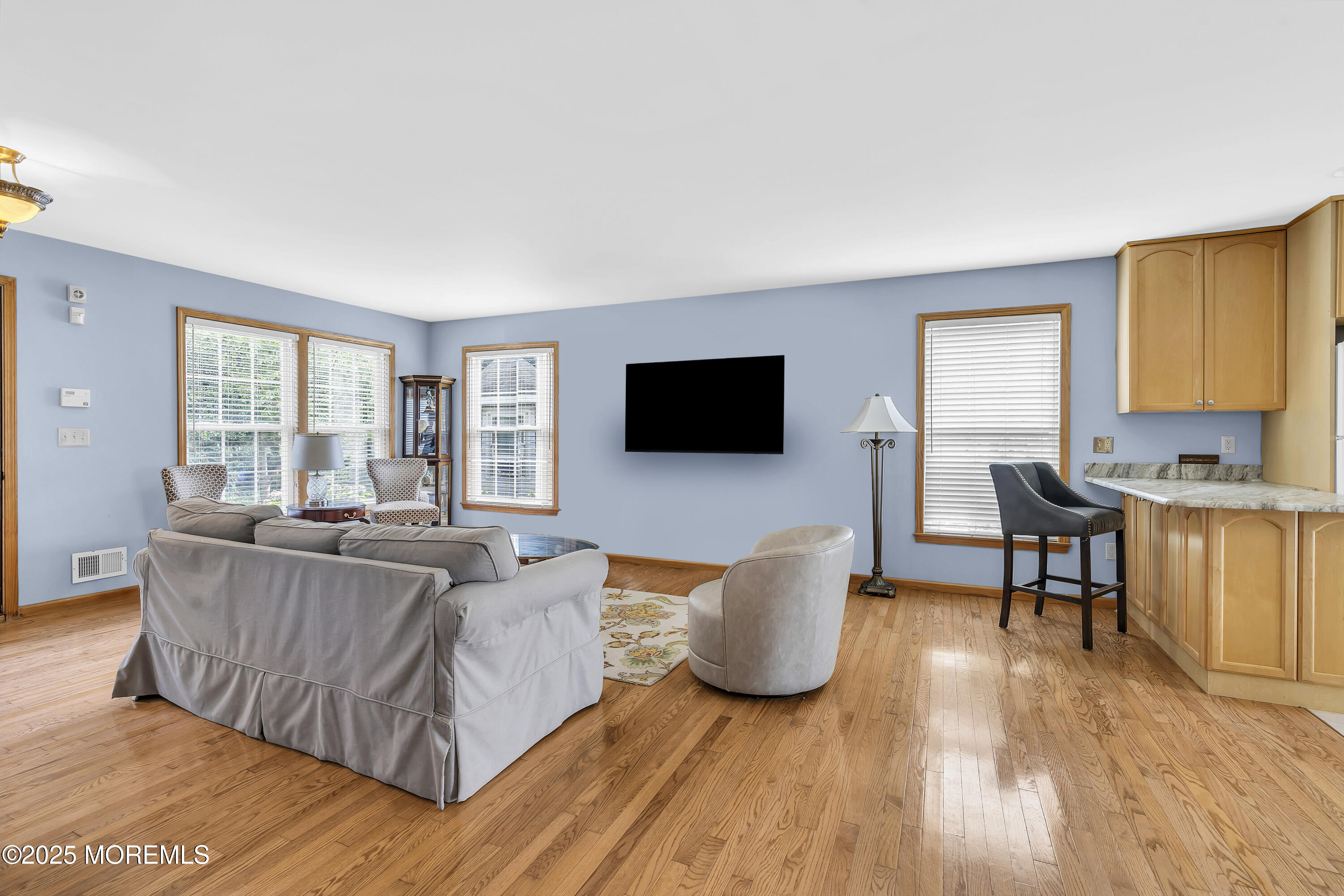 143 Lake Avenue Manasquan, NJ 08736 - Photo 15 of 18 a living room with furniture and a flat screen tv