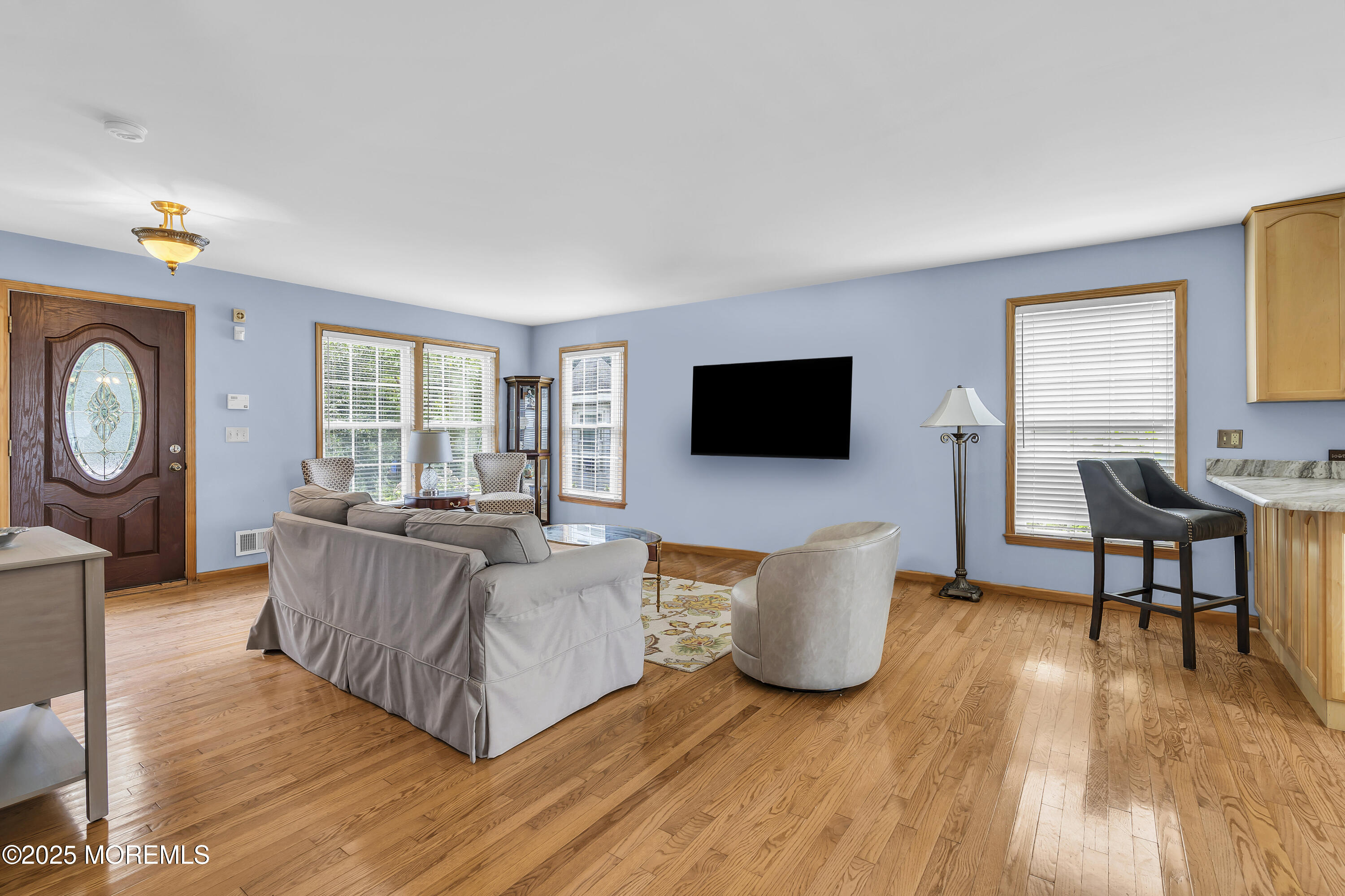 143 Lake Avenue Manasquan, NJ 08736 - Photo 16 of 18 a living room with furniture and a flat screen tv