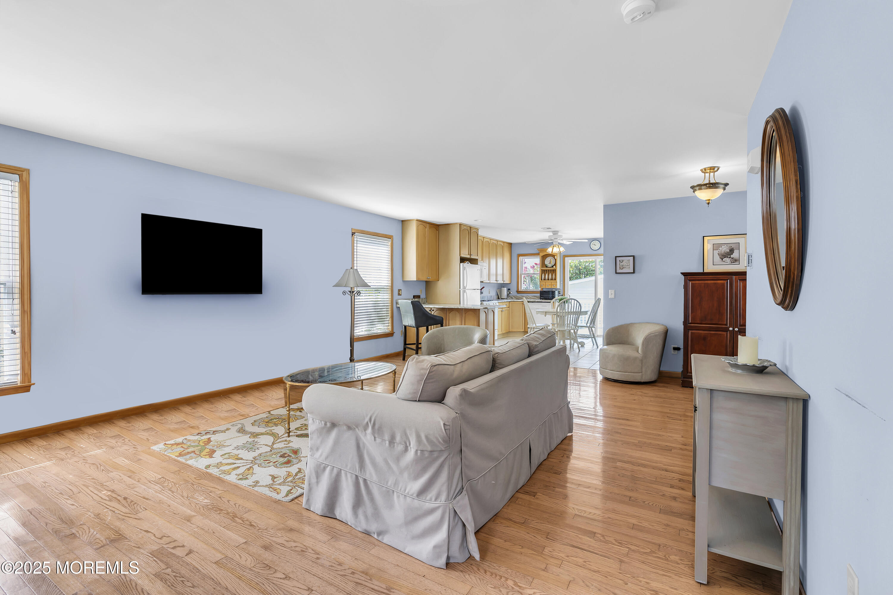 143 Lake Avenue Manasquan, NJ 08736 - Photo 4 of 18 a living room with furniture and a flat screen tv