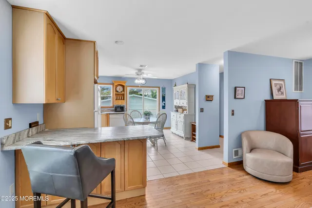 a view of kitchen with cabinets and wooden floor