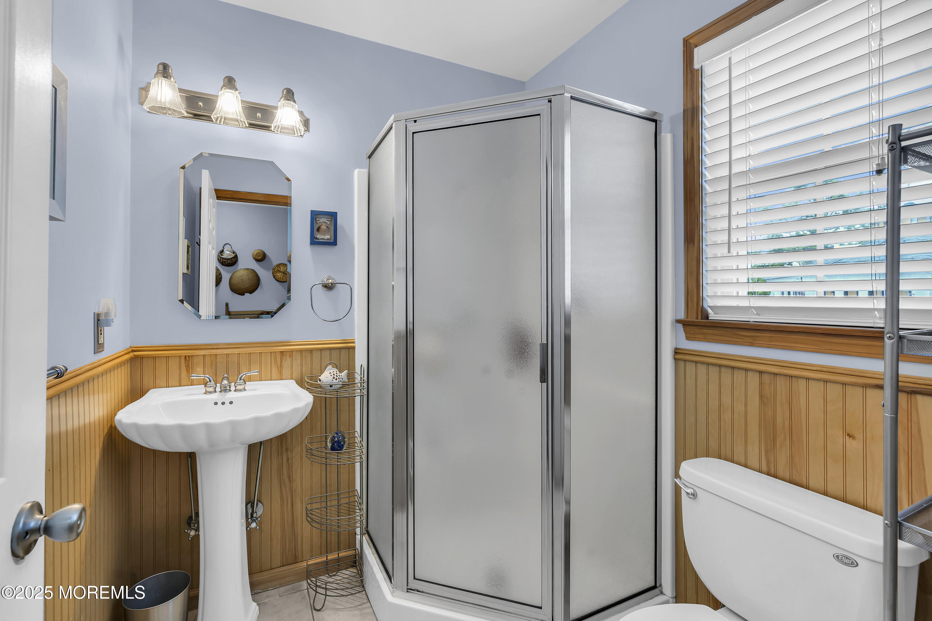 143 Lake Avenue Manasquan, NJ 08736 - Photo 9 of 18 a bathroom with a sink toilet and a mirror