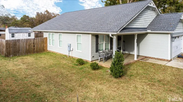 a aerial view of a house with a yard
