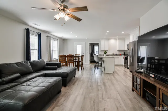 a living room with furniture and a large window