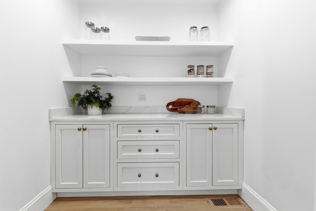 40 Foxcroft Road Winchester, MA 01890 - Photo 13 of 42 a view of white cabinets and a wooden floor