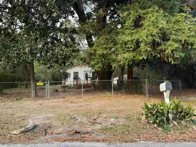a backyard of a house with lots of green space