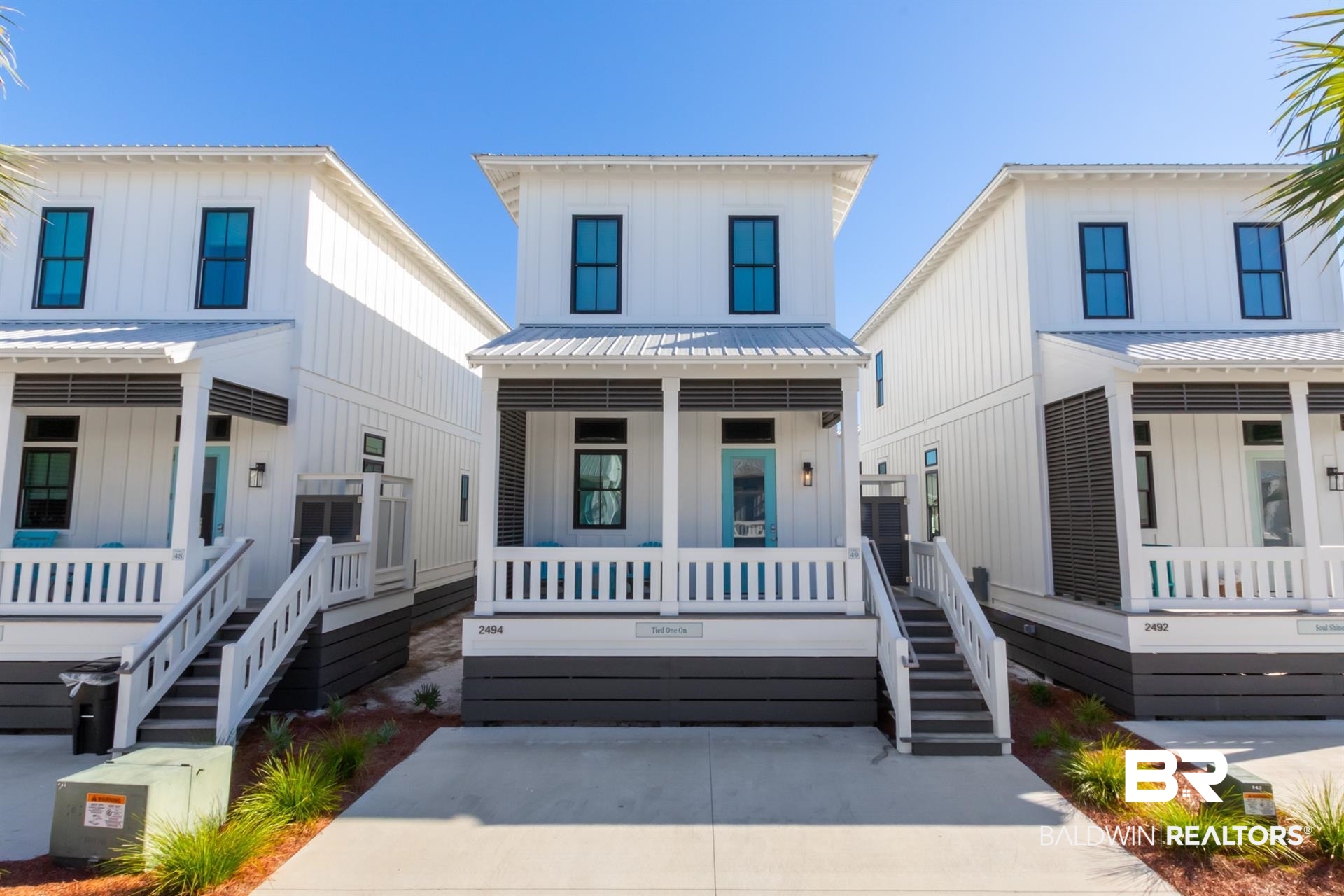 2494 Saltgrass Way Orange Beach, AL 36561 - Photo 1 of 37 Modern inspired farmhouse with a porch