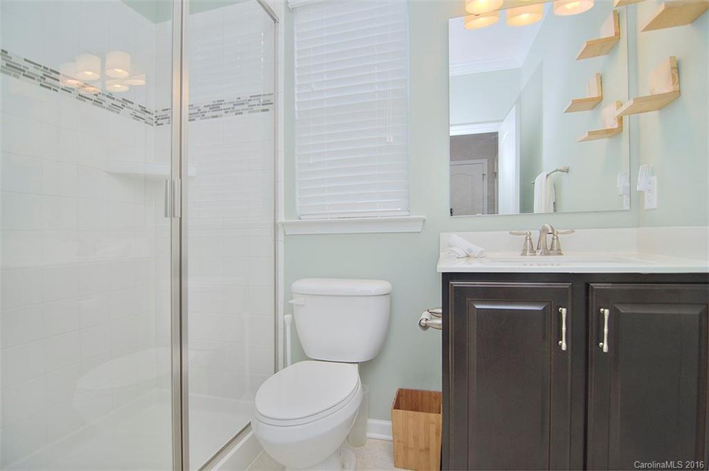 565 Brookhaven Drive Fort Mill, SC 29708 - Photo 11 of 24 a bathroom with a sink toilet vanity and shower
