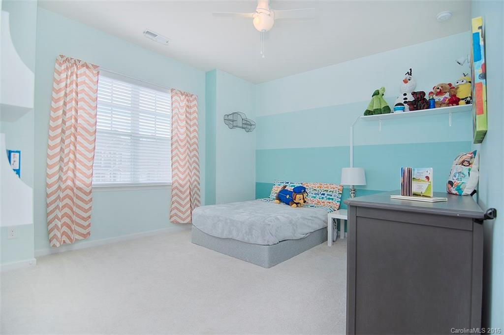 565 Brookhaven Drive Fort Mill, SC 29708 - Photo 18 of 24 a bedroom with a bed and a window