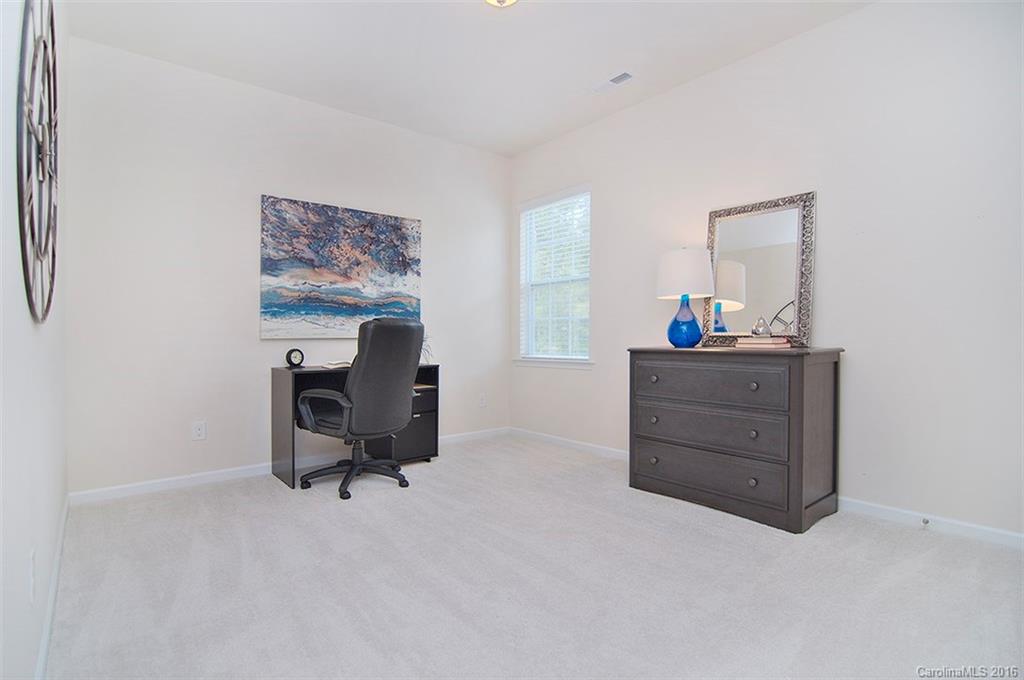 565 Brookhaven Drive Fort Mill, SC 29708 - Photo 19 of 24 a room with furniture and a chair