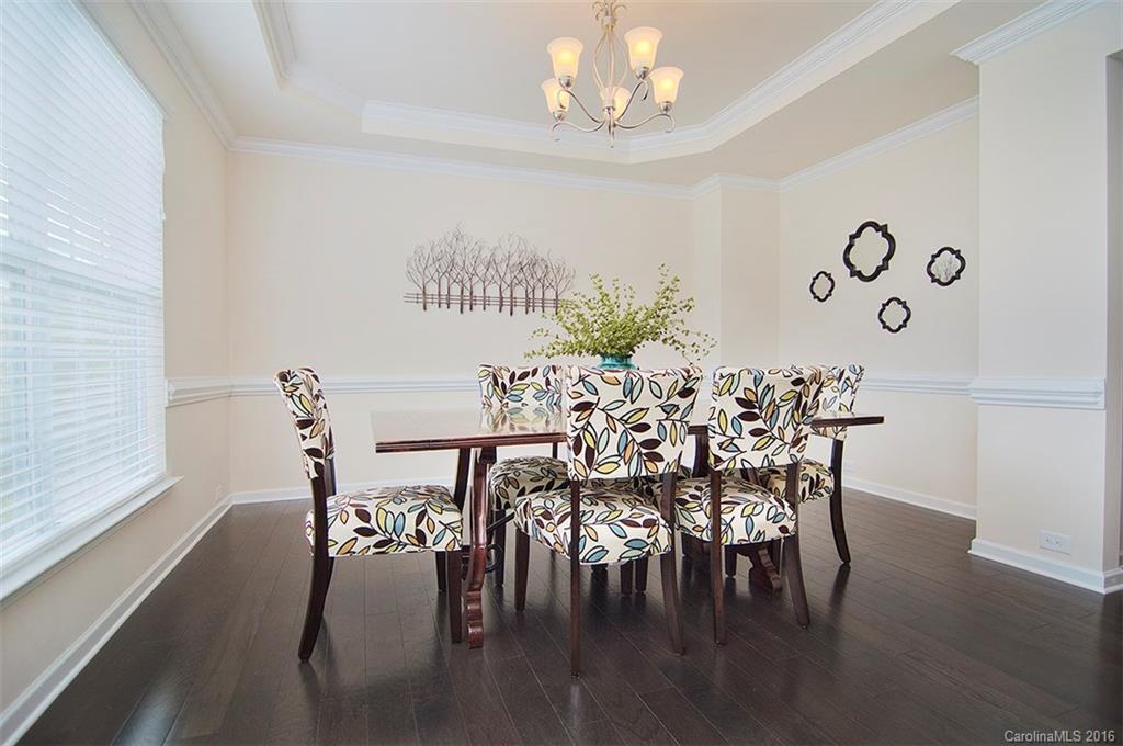 565 Brookhaven Drive Fort Mill, SC 29708 - Photo 3 of 24 a view of a dining room with furniture and wooden floor