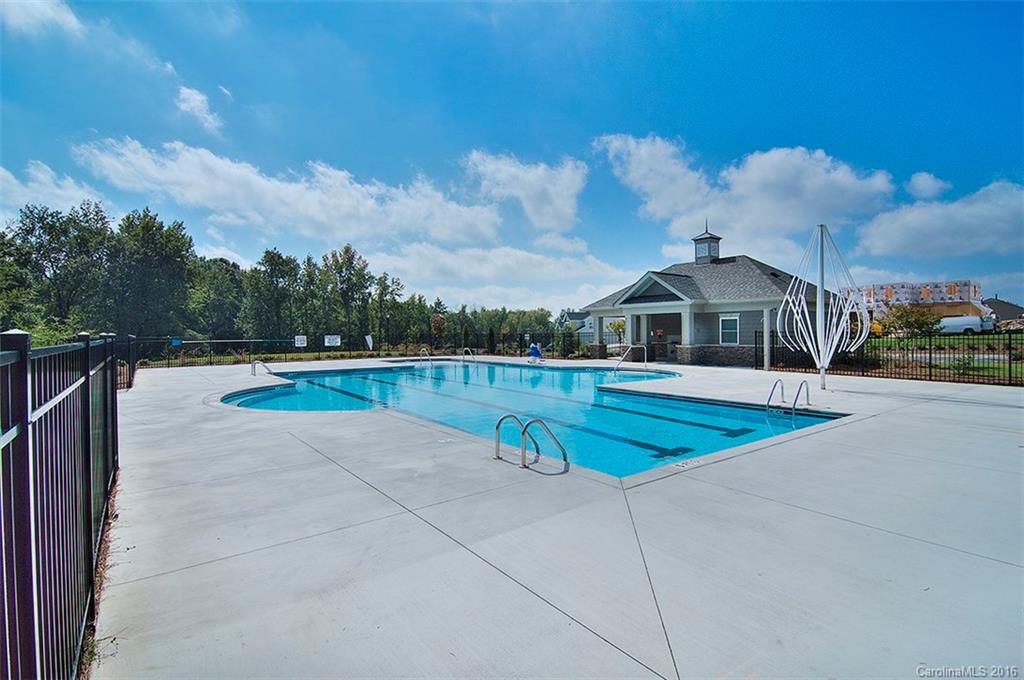 565 Brookhaven Drive Fort Mill, SC 29708 - Photo 24 of 24 a view of a house with swimming pool and a yard