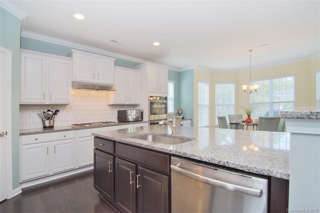 565 Brookhaven Drive Fort Mill, SC 29708 - Photo 6 of 24 a kitchen with sink stove and cabinets