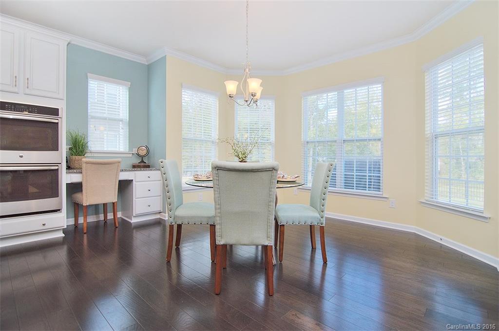 565 Brookhaven Drive Fort Mill, SC 29708 - Photo 7 of 24 a view of a dining room with furniture window and wooden floor